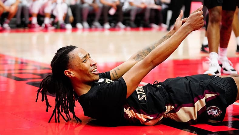 Nov 25, 2022; Orlando, FL, USA; Florida State Seminoles guard Caleb Mills (4) reacts to being fouls against the Stanford Cardinal during the second half at ESPN Wide World of Sports. Mandatory Credit: Rich Storry-USA TODAY Sports
