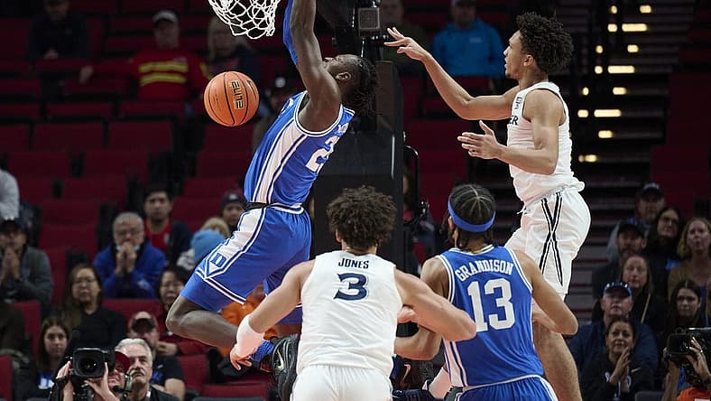 Nov 25, 2022; Portland, Oregon, USA; Duke Blue Devils forward Mark Mitchell (25) dunks the basketball during the first half against the Xavier Musketeers at Moda Center. Mandatory Credit: Troy Wayrynen-USA TODAY Sports