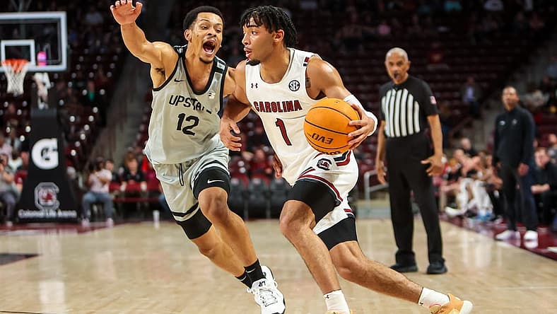 Nov 25, 2022; Charleston, South Carolina, USA; South Carolina Gamecocks guard Jacobi Wright (1) drives around USC Upstate Spartans guard Trae Broadnax (12) in the first half at Colonial Life Arena. Mandatory Credit: Jeff Blake-USA TODAY Sports