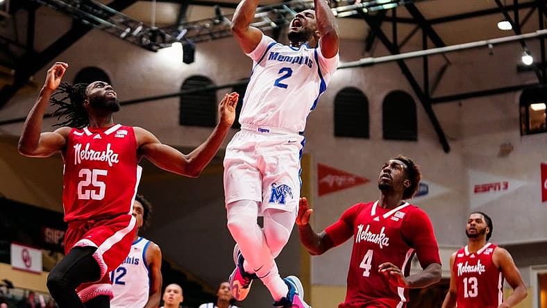 Nov 25, 2022; Orlando, FL, USA; Memphis Tigers guard Alex Lomax (2) shoots against Nebraska Cornhuskers guard Emmanuel Bandoumel (25) during the second half at ESPN Wide World of Sports. Mandatory Credit: Rich Storry-USA TODAY Sports