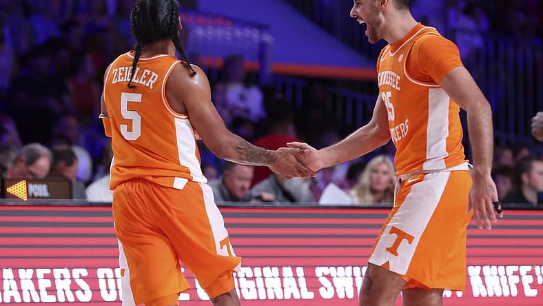 Nov 25, 2022; Paradise Island, BAHAMAS; Tennessee Volunteers guard Santiago Vescovi (25) celebrates with Tennessee Volunteers guard Zakai Zeigler (5) during the second half against the Kansas Jayhawks at Imperial Arena. Mandatory Credit: Kevin Jairaj-USA TODAY Sports