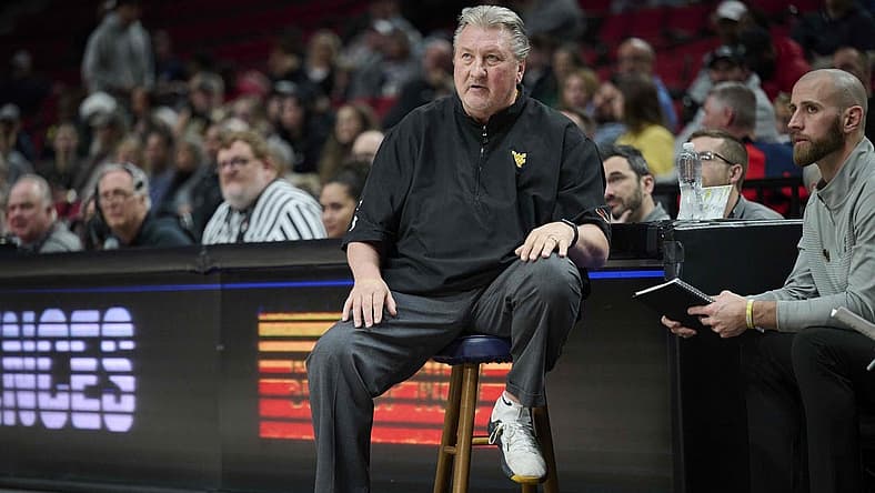 Nov 25, 2022; Portland, Oregon, USA; West Virginia Mountaineers head coach Bob Huggins watches his team during the first half against the Portland State Vikings at Moda Center. Mandatory Credit: Troy Wayrynen-USA TODAY Sports
