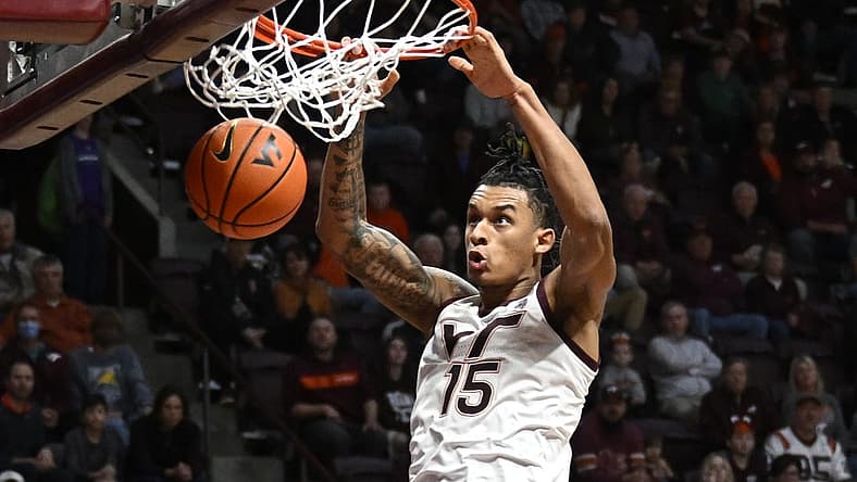 Nov 25, 2022; Blacksburg, Virginia, USA;Virginia Tech Hokies center Lynn Kidd (15) dunks in the second half against the Charleston Southern Buccaneers at Cassell Coliseum. Mandatory Credit: Lee Luther Jr.-USA TODAY Sports