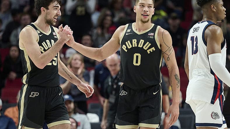 Nov 25, 2022; Portland, Oregon, USA; Purdue Boilermakers guard Ethan Morton (25) celebrates with Purdue Boilermakers forward Mason Gillis (0) after a game against the Gonzaga Bulldogs at Moda Center. Purdue won the game 84-66. Mandatory Credit: Troy Wayrynen-USA TODAY Sports