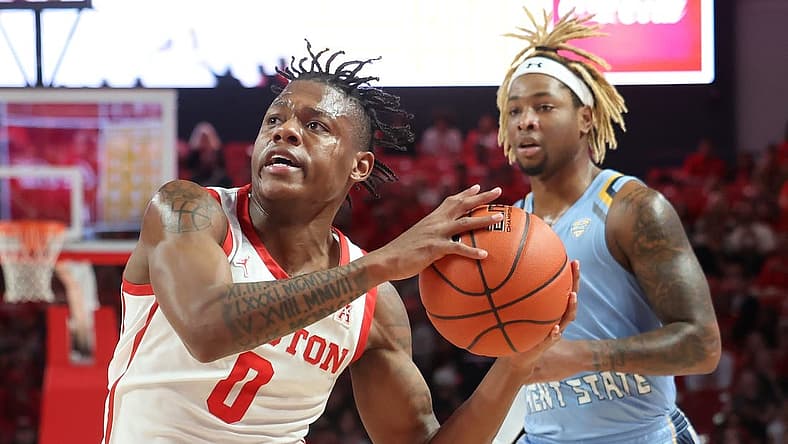 Nov 26, 2022; Houston, Texas, USA; Houston Cougars guard Marcus Sasser (0) drives to the net as Kent State Golden Flashes forward VonCameron Davis (1) chases in the first half at the Fertitta Center. Mandatory Credit: Thomas Shea-USA TODAY Sports