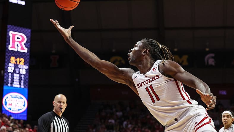 Nov 26, 2022; Piscataway, New Jersey, USA; Rutgers Scarlet Knights center Clifford Omoruyi (11) reaches for a rebound during the first half against the Central Connecticut State Blue Devils at Jersey Mike's Arena. Mandatory Credit: Vincent Carchietta-USA TODAY Sports