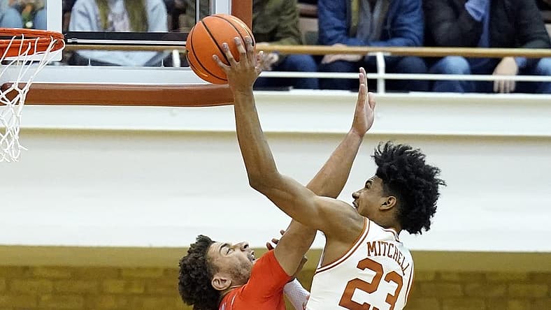 Nov 26, 2022; Austin, Texas, USA; Texas Longhorns forward Dillon Mitchell (23) shoots over Texas Rio Grande Valley Vaqueros forward Ahren Freeman (11) during the second half at Gregory Gymnasium. Mandatory Credit: Scott Wachter-USA TODAY Sports