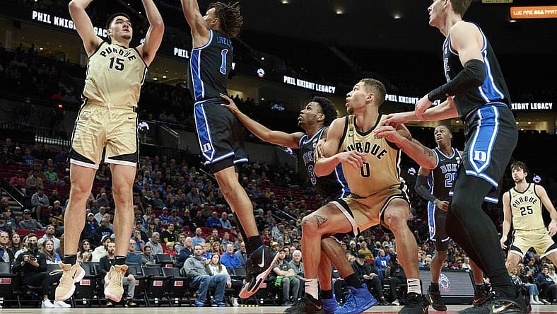 Nov 27, 2022; Portland, Oregon, USA; Purdue Boilermakers center Zach Edey (15) shoots a basket during the first half against Duke Blue Devils center Dereck Lively II (1) at Moda Center. Mandatory Credit: Troy Wayrynen-USA TODAY Sports