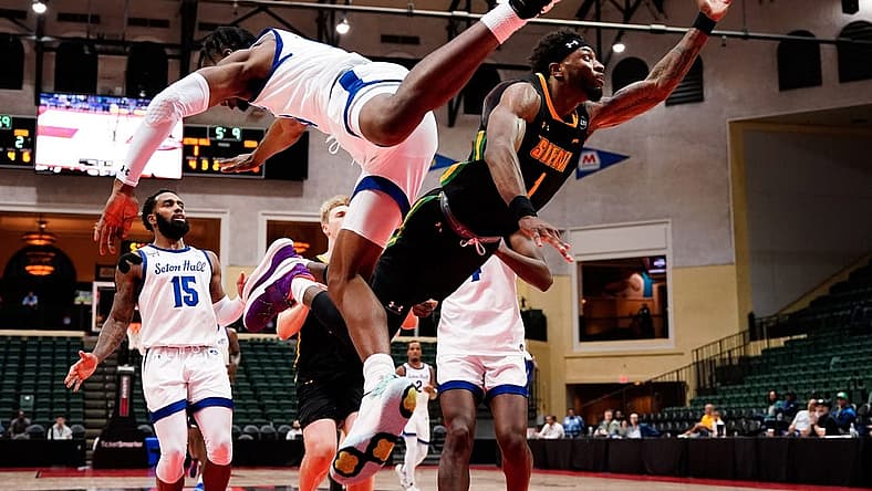 Nov 27, 2022; Orlando, FL, USA; Siena Saints guard Jared Billups (1) shoots against Seton Hall Pirates forward KC Ndefo (13) during the first half at ESPN Wide World of Sports. Mandatory Credit: Rich Storry-USA TODAY Sports