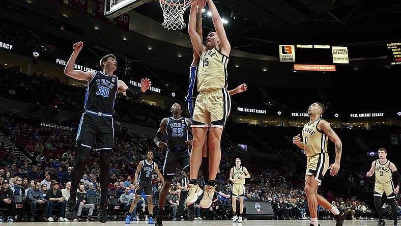Nov 27, 2022; Portland, Oregon, USA; Purdue Boilermakers center Zach Edey (15) dunks the ball during the first half against Duke Blue Devils center Dereck Lively II (1) at Moda Center. Purdue won the Phil Knight Legacy Championship game 75-56. Mandatory Credit: Troy Wayrynen-USA TODAY Sports