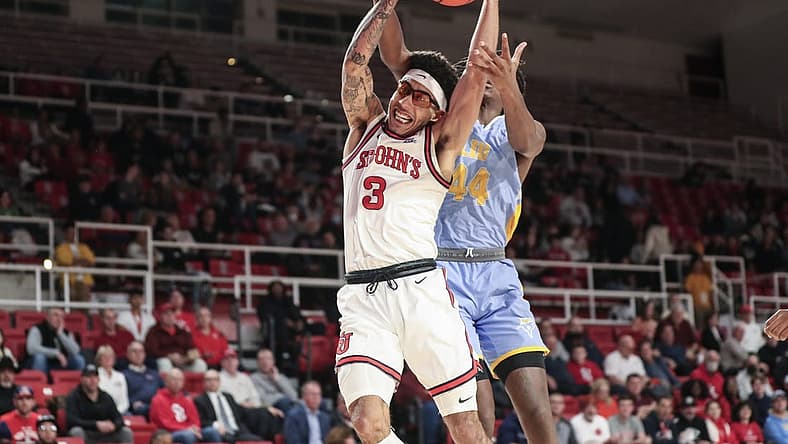 Nov 29, 2022; Queens, New York, USA; St. John's Red Storm guard Andre Curbelo (3) and Long Island University guard Quion Burns (44) fight for a rebound in the first half at Carnesecca Arena. Mandatory Credit: Wendell Cruz-USA TODAY Sports