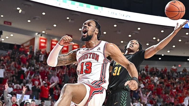 Nov 29, 2022; Houston, Texas, USA; Houston Cougars forward J'Wan Roberts (13) reacts after a dunk against the Norfolk State Spartans during the first half at Fertitta Center. Mandatory Credit: Maria Lysaker-USA TODAY Sports