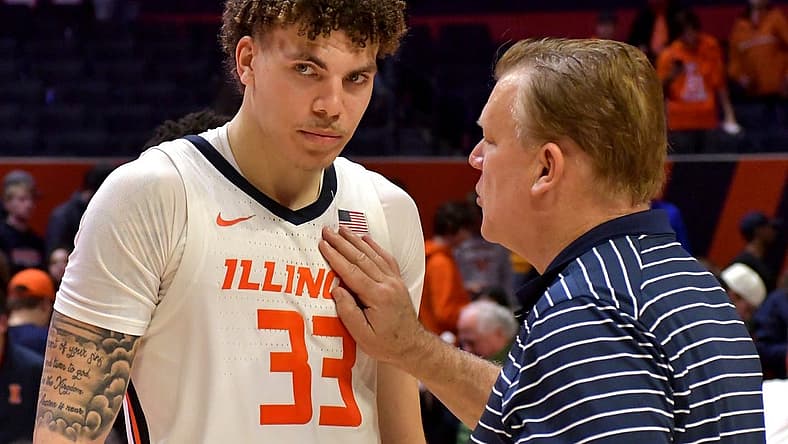 Nov 29, 2022; Champaign, Illinois, USA; Illinois Fighting Illini head coach Brad Underwood congratulates player Coleman Hawkins after his triple-double after a 73-44 win over the Syracuse Orange at State Farm Center. Mandatory Credit: Ron Johnson-USA TODAY Sports