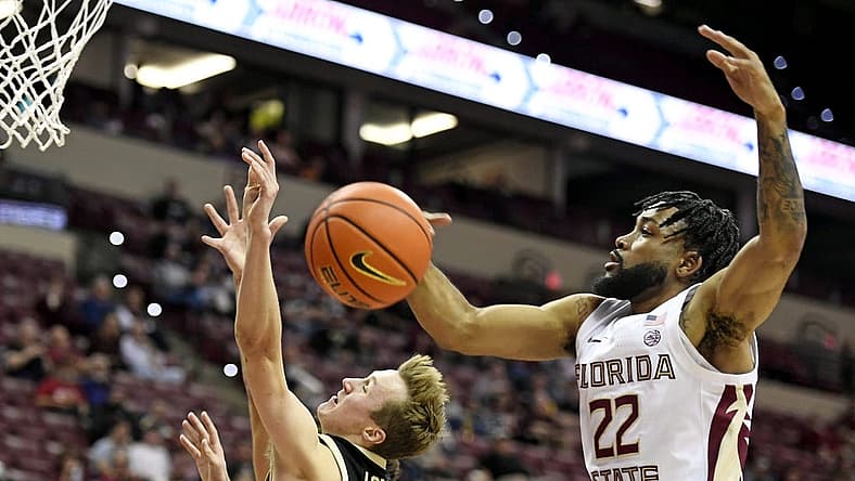 Nov 30, 2022; Tallahassee, Florida, USA; Purdue Boilermakers guard Fletcher Loyer (2) has his shot blocked by Florida State Seminoles guard Darin Green Jr. (22) during the first half at Donald L. Tucker Center. Mandatory Credit: Melina Myers-USA TODAY Sports