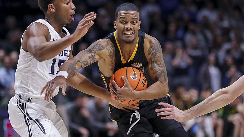 Nov 30, 2022; Cincinnati, Ohio, USA; Southeastern Louisiana Lions guard Christian Agnew (24) moves to the basket against Xavier Musketeers guard KyKy Tandy (15) in the first half at Cintas Center. Mandatory Credit: Katie Stratman-USA TODAY Sports
