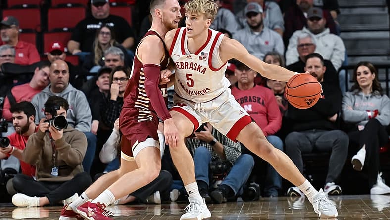 Nov 30, 2022; Lincoln, Nebraska, USA; Nebraska Cornhuskers guard Sam Griesel (5) drives against Boston College Eagles guard Mason Madsen (45) in the second half at Pinnacle Bank Arena. Mandatory Credit: Steven Branscombe-USA TODAY Sports