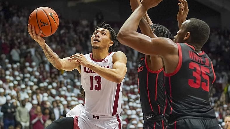 Dec 11, 2021; Tuscaloosa, Alabama, USA; Alabama Crimson Tide guard Jahvon Quinerly (13) goes to the basket against Houston Cougars during the second half at Coleman Coliseum. Mandatory Credit: Marvin Gentry-USA TODAY Sports