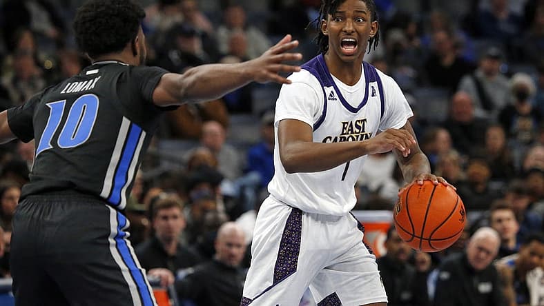 Jan 27, 2022; Memphis, Tennessee, USA; East Carolina Pirates guard Javon Small (1) dribbles as Memphis Tigers guard Alex Lomax (10) defends during the second half at FedExForum. Mandatory Credit: Petre Thomas-USA TODAY Sports