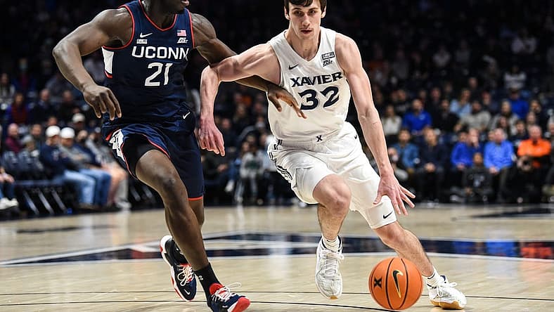 Xavier's Zach Freemantle takes the ball down the court during the game between Xavier and Uconn at Cintas Center on Friday February 11, 2022. Xavier lead the game at halftime with a score of 34-31.