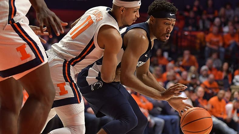 Mar 3, 2022; Champaign, Illinois, USA; Penn State Nittany Lions guard Jalen Pickett (22) dribbles the ball past Illinois Fighting Illini guard Alfonso Plummer (11) during the second half at State Farm Center. Mandatory Credit: Ron Johnson-USA TODAY Sports