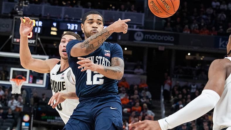 Mar 11, 2022; Indianapolis, IN, USA; Penn State Nittany Lions guard Sam Sessoms (12) passes the ball while Purdue Boilermakers forward Mason Gillis (0) defends in the first half at Gainbridge Fieldhouse. Mandatory Credit: Trevor Ruszkowski-USA TODAY Sports