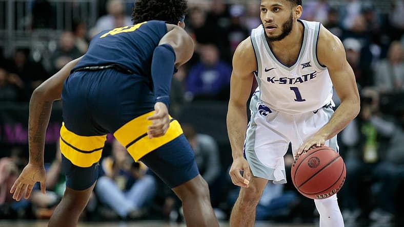 Mar 9, 2022; Kansas City, MO, USA; Kansas State Wildcats guard Markquis Nowell (1) sets the play against the West Virginia Mountaineers at T-Mobile Center. Mandatory Credit: William Purnell-USA TODAY Sports