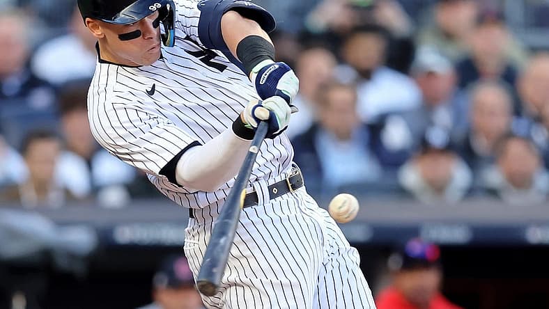 Oct 18, 2022; Bronx, New York, USA; New York Yankees right fielder Aaron Judge (99) hits a home run against the Cleveland Guardians during the second inning in game five of the ALDS for the 2022 MLB Playoffs at Yankee Stadium. Mandatory Credit: Brad Penner-USA TODAY Sports