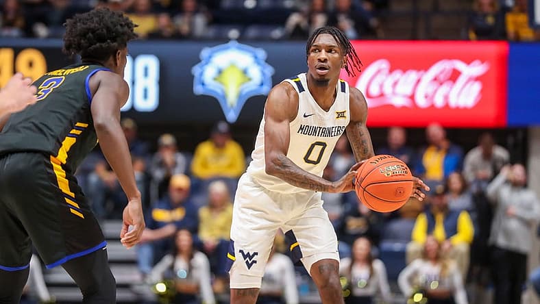 Nov 15, 2022; Morgantown, West Virginia, USA; West Virginia Mountaineers guard Kedrian Johnson (0) passes the ball during the second half against the Morehead State Eagles at WVU Coliseum. Mandatory Credit: Ben Queen-USA TODAY Sports