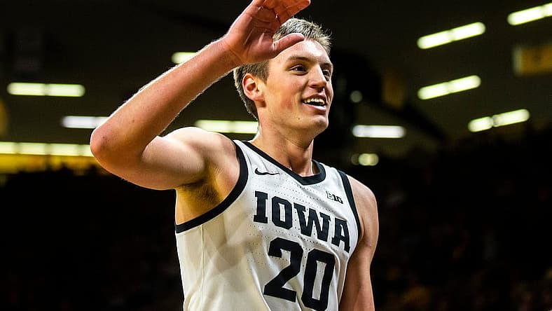 Iowa forward Payton Sandfort (20) high-fives teammates during a NCAA men's basketball game against Omaha, Monday, Nov. 21, 2022, at Carver-Hawkeye Arena in Iowa City, Iowa.

221121 Omaha Iowa Mbb 044 Jpg