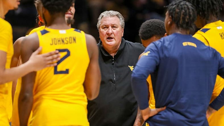 Nov 18, 2022; Morgantown, West Virginia, USA; West Virginia Mountaineers head coach Bob Huggins talks to his team during the second half against the Pennsylvania Quakers at WVU Coliseum. Mandatory Credit: Ben Queen-USA TODAY Sports