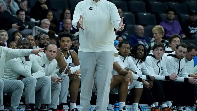 Providence College coach Ed Cooley expression his frustration of a call against the Friars from the bench.