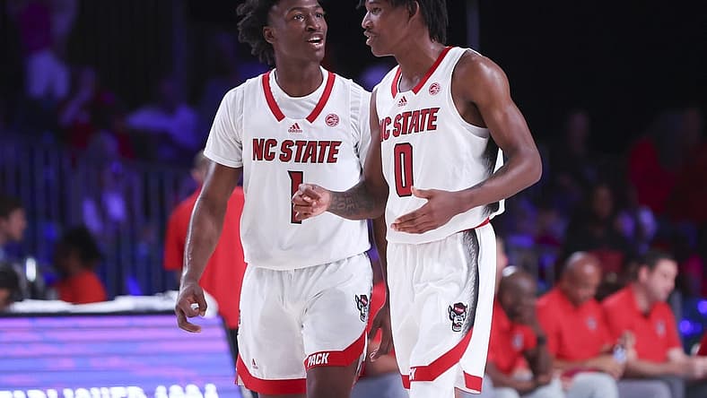 Nov 24, 2022; Paradise Island, BAHAMAS; North Carolina State Wolfpack guard Jarkel Joiner (1) laughs with North Carolina State Wolfpack guard Terquavion Smith (0) during the second half against the Dayton Flyers at Imperial Arena. Mandatory Credit: Kevin Jairaj-USA TODAY Sports