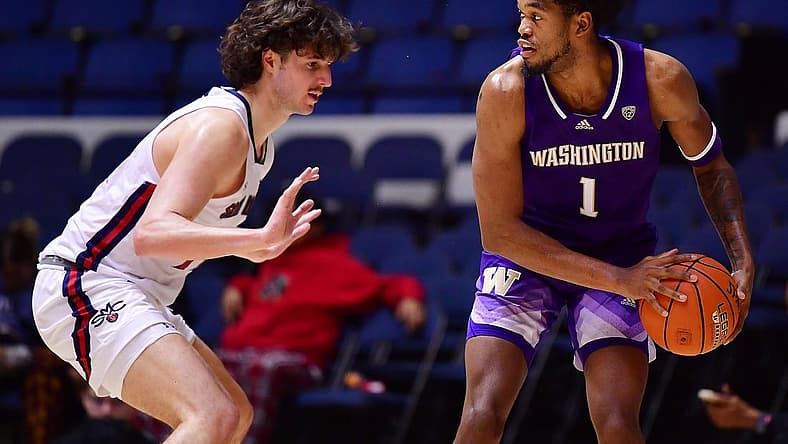 Nov 24, 2022; Anaheim, California, USA; Washington Huskies forward Keion Brooks (1) controls the ball against St. Mary's Gaels forward Kyle Bowen (14) during the second half at Anaheim Convention Center. Mandatory Credit: Gary A. Vasquez-USA TODAY Sports