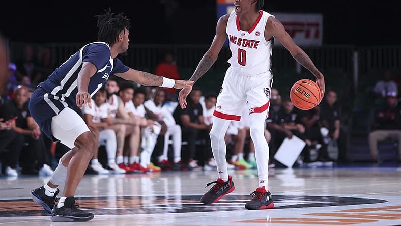 Nov 25, 2022; Paradise Island, BAHAMAS; North Carolina State Wolfpack guard Terquavion Smith (0) dribbles as Butler Bulldogs guard Jayden Taylor (13) defends during the first half at Imperial Arena. Mandatory Credit: Kevin Jairaj-USA TODAY Sports