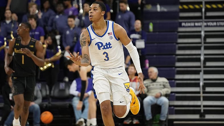 Nov 28, 2022; Evanston, Illinois, USA; Pittsburgh Panthers guard Greg Elliott (3) celebrates a three point basket against the Northwestern Wildcats during the second half at Welsh-Ryan Arena. Mandatory Credit: David Banks-USA TODAY Sports