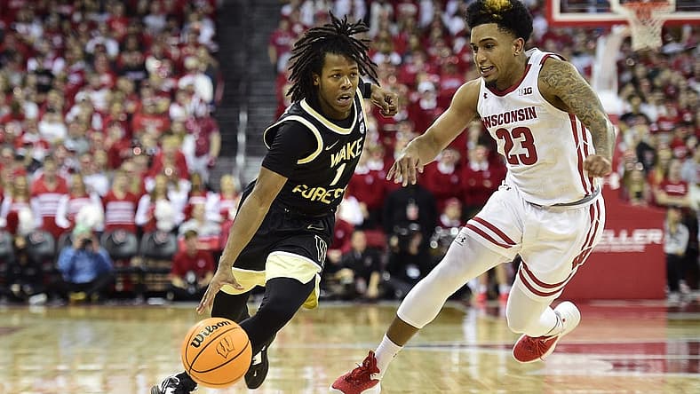 Nov 29, 2022; Madison, Wisconsin, USA; Wake Forest Demon Deacons guard Tyree Appleby (1) drives to the basket under coverage by Wisconsin Badgers guard Chucky Hepburn (23) during the first half at the Kohl Center. Mandatory Credit: Kayla Wolf-USA TODAY Sports