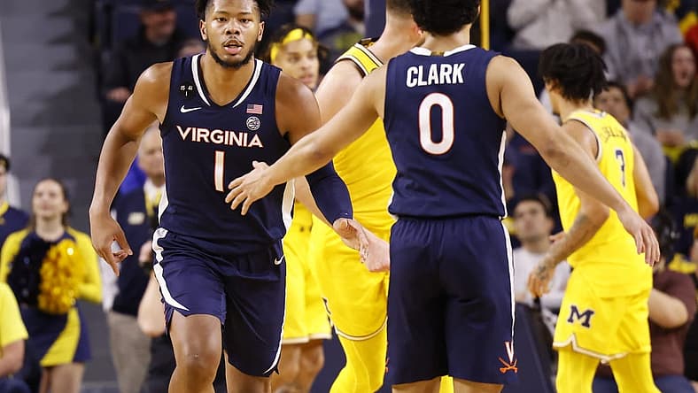 Nov 29, 2022; Ann Arbor, Michigan, USA; Virginia Cavaliers forward Jayden Gardner (1) receives congratulations from guard Kihei Clark (0) in the first half against the Michigan Wolverines at Crisler Center. Mandatory Credit: Rick Osentoski-USA TODAY Sports