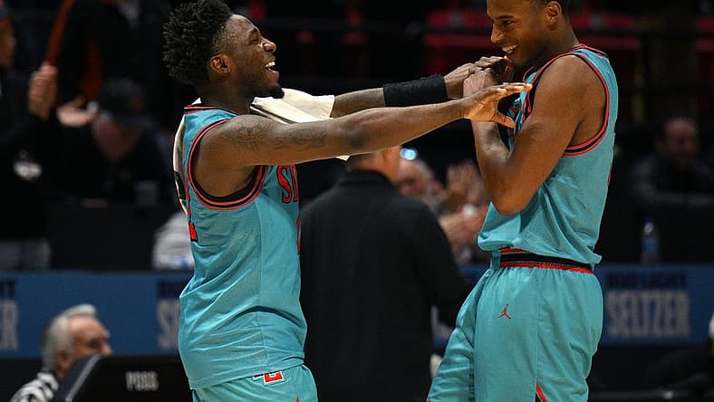 Nov 29, 2022; San Diego, California, USA; San Diego State Aztecs guard Darrion Trammell (left) and guard Micah Parrish (right) celebrate after defeating the UC Irvine Anteaters at Viejas Arena. Mandatory Credit: Orlando Ramirez-USA TODAY Sports
