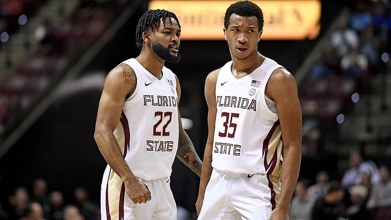 Nov 30, 2022; Tallahassee, Florida, USA; Florida State Seminoles guard Matthew Cleveland (35) and Darin Green Jr. (22) react to a play during the first half against the Purdue Boilermakers at Donald L. Tucker Center. Mandatory Credit: Melina Myers-USA TODAY Sports