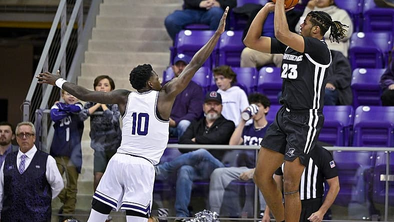 Nov 30, 2022; Fort Worth, Texas, USA; Providence Friars forward Bryce Hopkins (23) shoots over TCU Horned Frogs guard Damion Baugh (10) during the first half at Ed and Rae Schollmaier Arena. Mandatory Credit: Jerome Miron-USA TODAY Sports