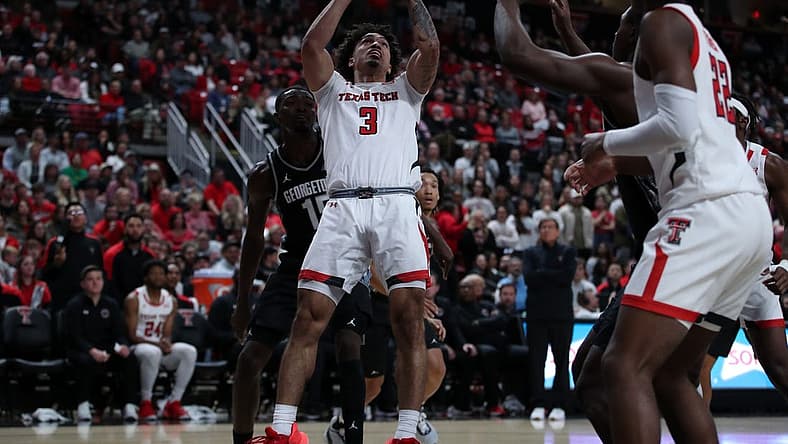 Nov 30, 2022; Lubbock, Texas, USA; Texas Tech Red Raiders guard D Maurian Williams (3) shoots in front of Georgetown Hoyas forward Bryson Mozone (15) in the second half at United Supermarkets Arena. Mandatory Credit: Michael C. Johnson-USA TODAY Sports