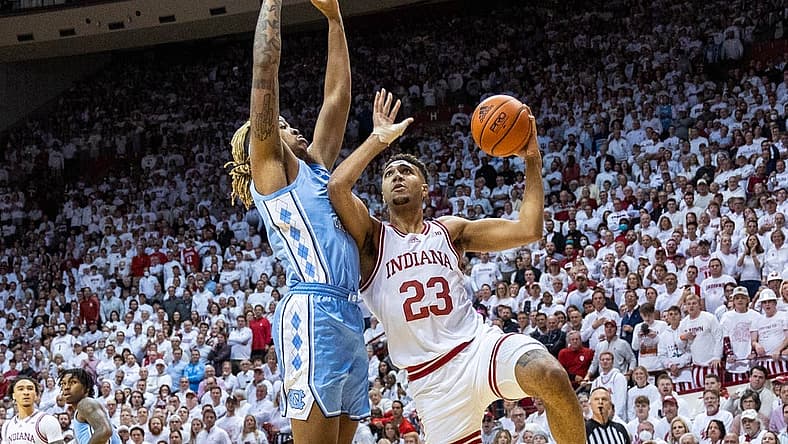 Nov 30, 2022; Bloomington, Indiana, USA; Indiana Hoosiers forward Trayce Jackson-Davis (23) shoots the ball while North Carolina Tar Heels forward Armando Bacot (5) defends in the first half  at Simon Skjodt Assembly Hall. Mandatory Credit: Trevor Ruszkowski-USA TODAY Sports