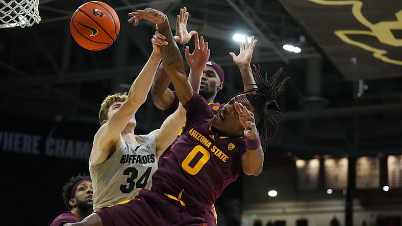 Dec 1, 2022; Boulder, Colorado, USA; Arizona State Sun Devils guard DJ Horne (0) and Colorado Buffaloes center Lawson Lovering (34) reach for a loose ball in the first half at the CU Events Center. Mandatory Credit: Ron Chenoy-USA TODAY Sports