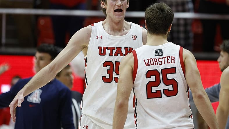 Dec 1, 2022; Salt Lake City, Utah, USA; Utah Utes center Branden Carlson (35) shows his excitement with guard Rollie Worster (25) in the second half against the Arizona Wildcats at Jon M. Huntsman Center. Mandatory Credit: Jeffrey Swinger-USA TODAY Sports