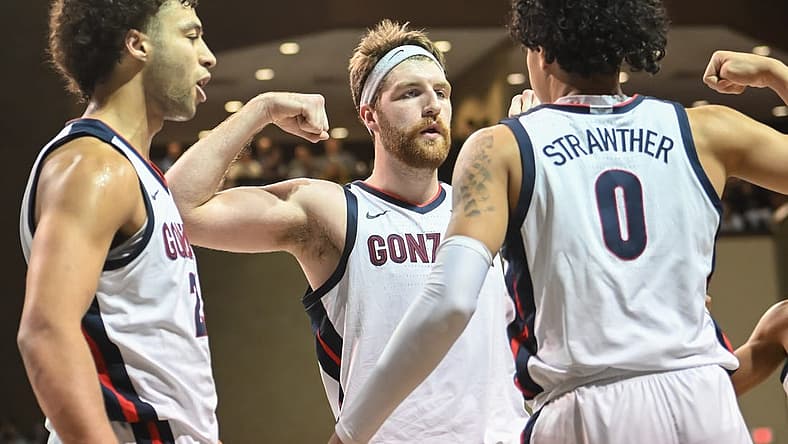 Dec 2, 2022; Sioux Falls, South Dakota, USA; Gonzaga Bulldogs guard Julian Strawther (0) reacts with forward Drew Timme (2) and forward Anton Watson (22) after a basket against the Baylor Bears in the second half at Sanford Pentagon. Mandatory Credit: Steven Branscombe-USA TODAY Sports
