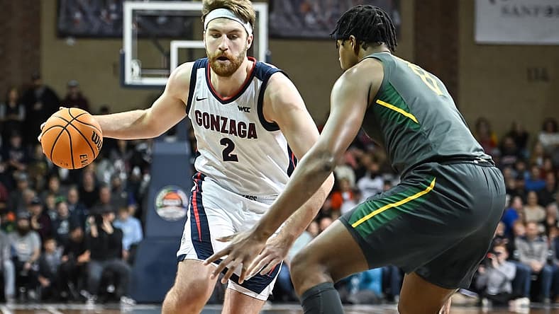 Dec 2, 2022; Sioux Falls, South Dakota, USA; Gonzaga Bulldogs forward Drew Timme (2) drives against Baylor Bears forward Flo Thamba (0) in the first half at Sanford Pentagon. Mandatory Credit: Steven Branscombe-USA TODAY Sports