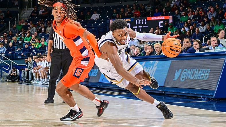 Dec 3, 2022; South Bend, Indiana, USA; Notre Dame Fighting Irish guard JJ Starling (1) dribbles as Syracuse Orange forward Chris Bell (0) defends in the first half at the Purcell Pavilion. Mandatory Credit: Matt Cashore-USA TODAY Sports
