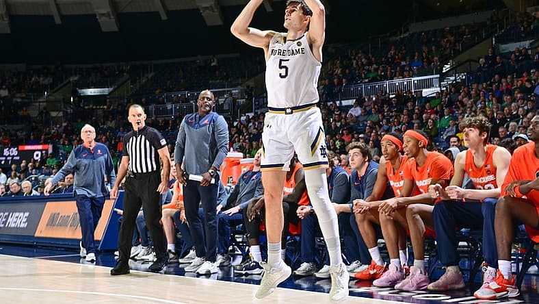 Dec 3, 2022; South Bend, Indiana, USA; Notre Dame Fighting Irish guard Cormac Ryan (5) shoots a three point basket in the first half against the Syracuse Orange at the Purcell Pavilion. Mandatory Credit: Matt Cashore-USA TODAY Sports