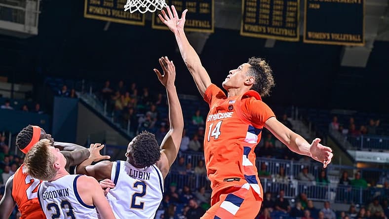 Dec 3, 2022; South Bend, Indiana, USA; Syracuse Orange center Jesse Edwards (14) reaches for a rebound over Notre Dame Fighting Irish forward Ven-Allen Lubin (2) in the second half at the Purcell Pavilion. Mandatory Credit: Matt Cashore-USA TODAY Sports