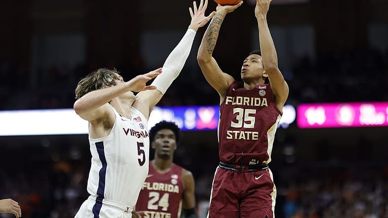 Dec 3, 2022; Charlottesville, Virginia, USA; Florida State Seminoles guard Matthew Cleveland (35) shoots the ball over Virginia Cavaliers forward Ben Vander Plas (5) in the first half at John Paul Jones Arena. Mandatory Credit: Geoff Burke-USA TODAY Sports